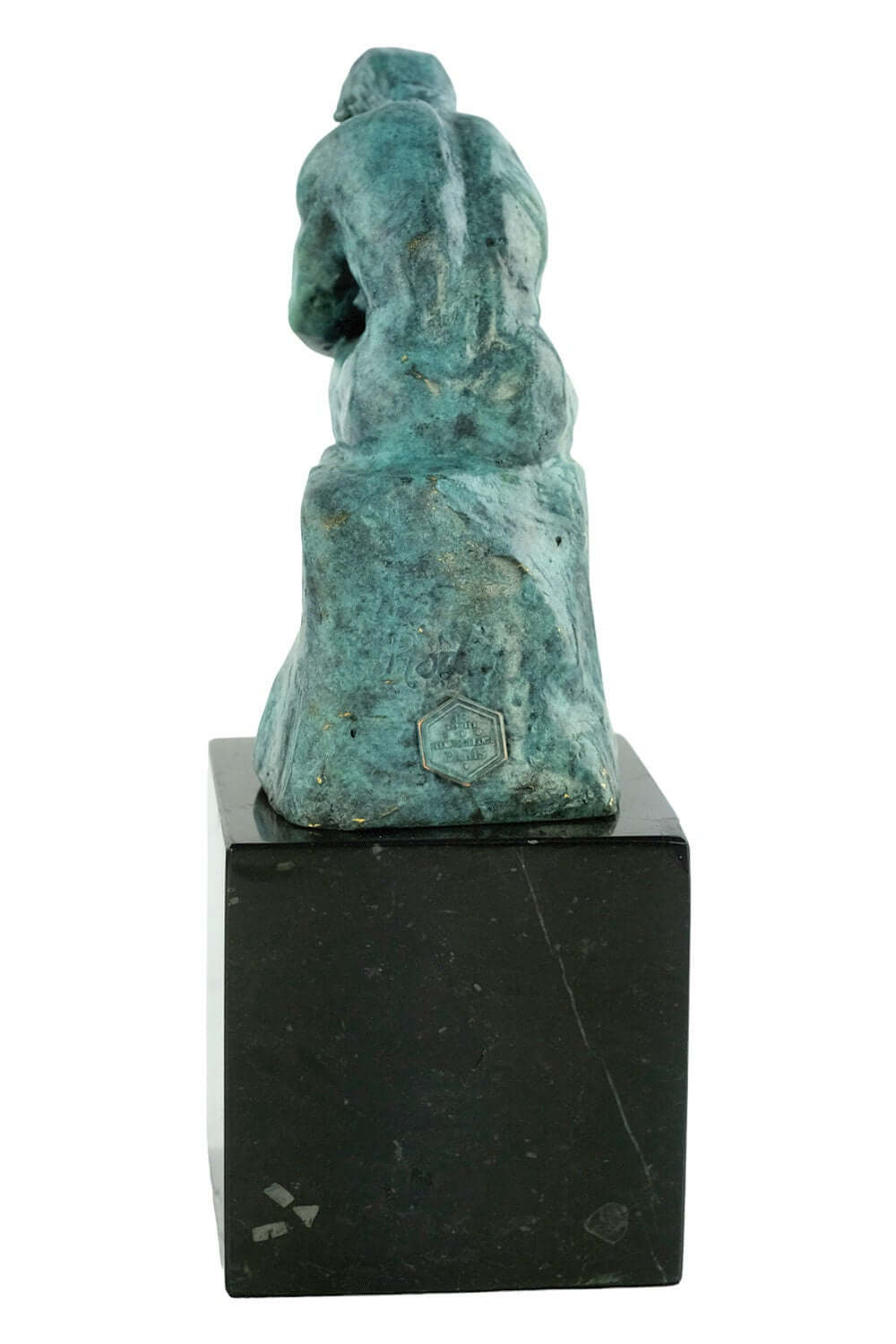 Back view of Rodin's bronze 'The Thinker' sculpture in green patina on black marble base, height 20 cm.