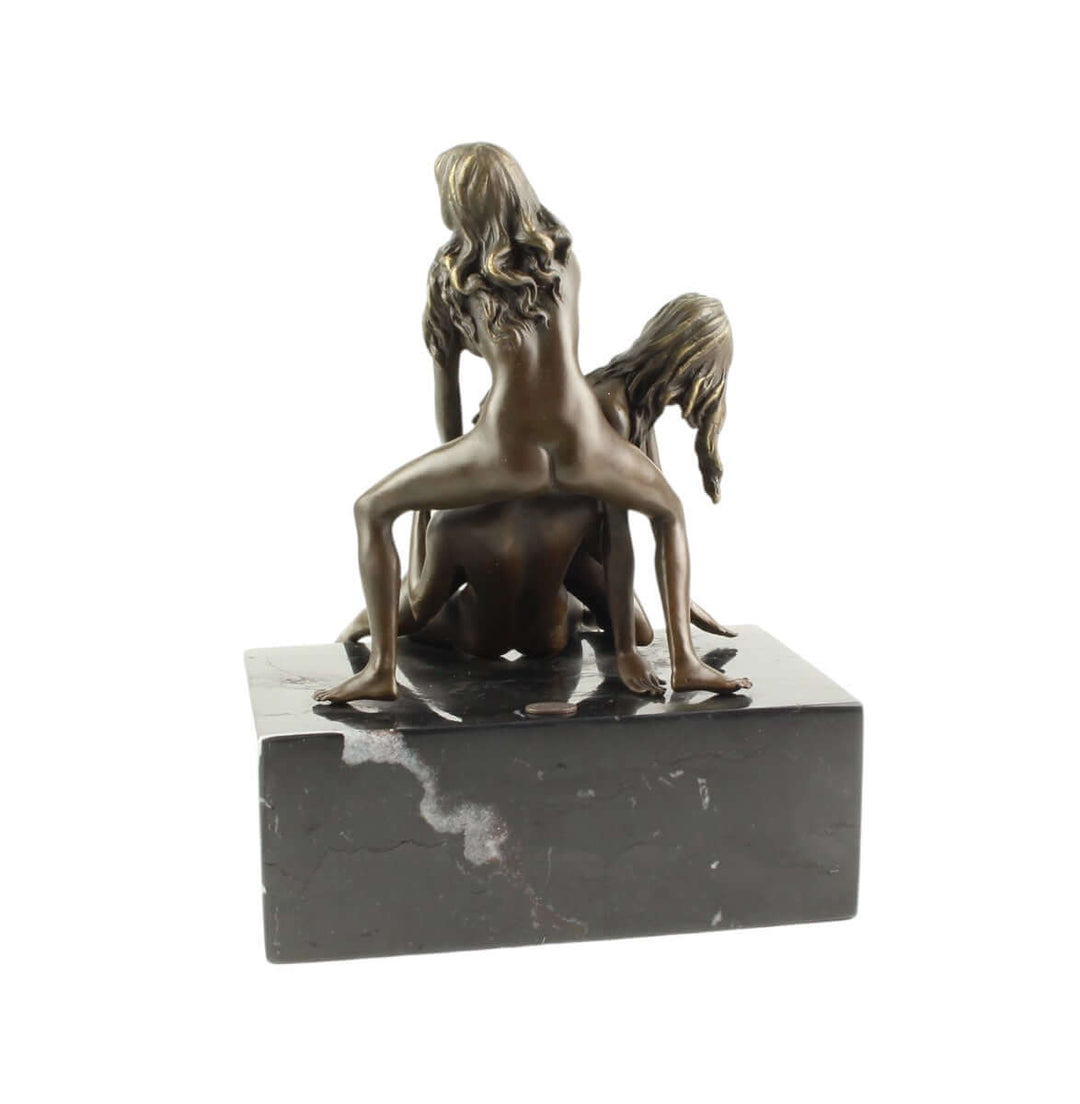 Bronze sculpture of a trio lovemaking scene on marble base, depicting dynamic erotic poses of a man and two females.