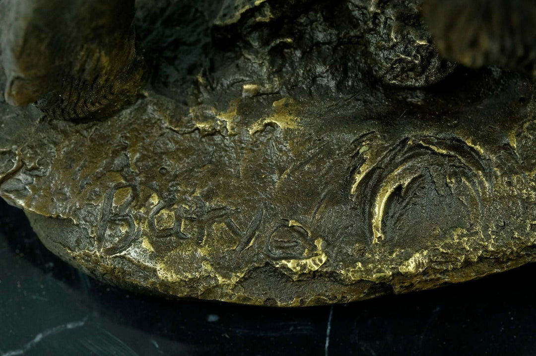 Close-up of signature on bronze wild boar sculpture by Antoine-Louis Barye, showcasing fine craftsmanship.
