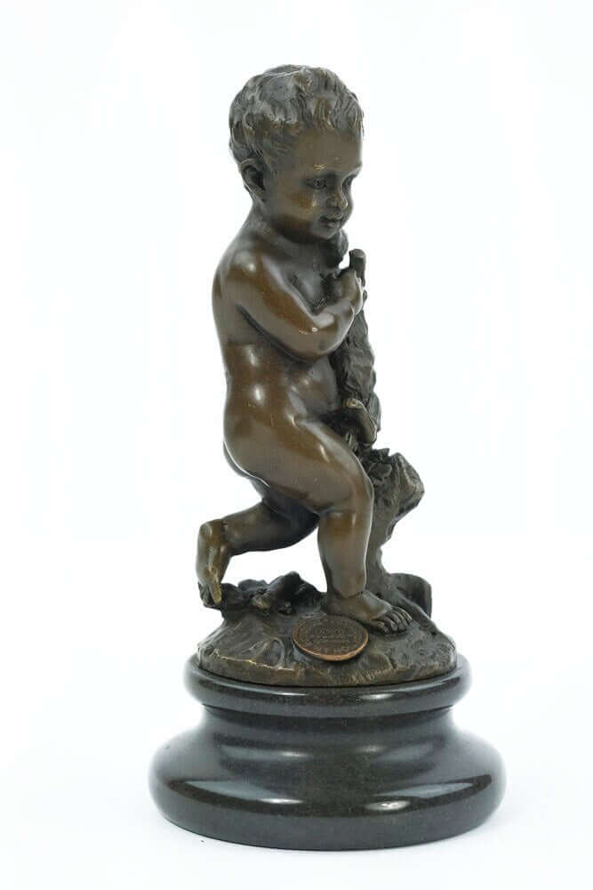 Bronze sculpture of a young boy joyfully holding a rabbit, mounted on a round marble base, 15 cm tall.