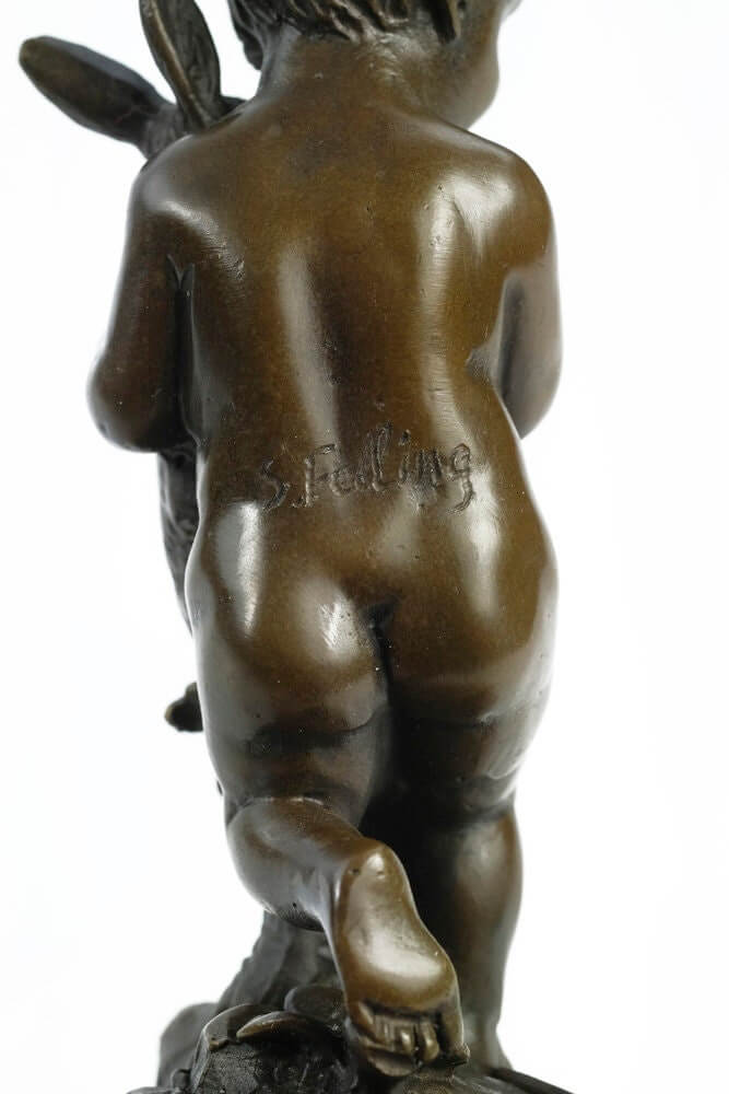 Bronze sculpture back view of a young boy holding a rabbit, signed by Julius Schmidt-Felling, 15 cm tall.