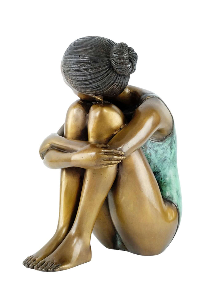 Adorable bronze sculpture of a young girl in a swimsuit, resting her head on her knees, 29cm tall.