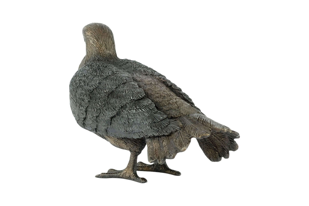 Bronze sculpture of a standing pigeon with detailed feathers, perfect for home or garden decor.