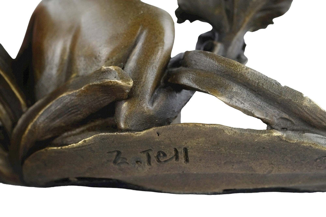 Close-up of E. Tell signature on a bronze tray featuring floral motifs and a bathing female in Art Nouveau style.