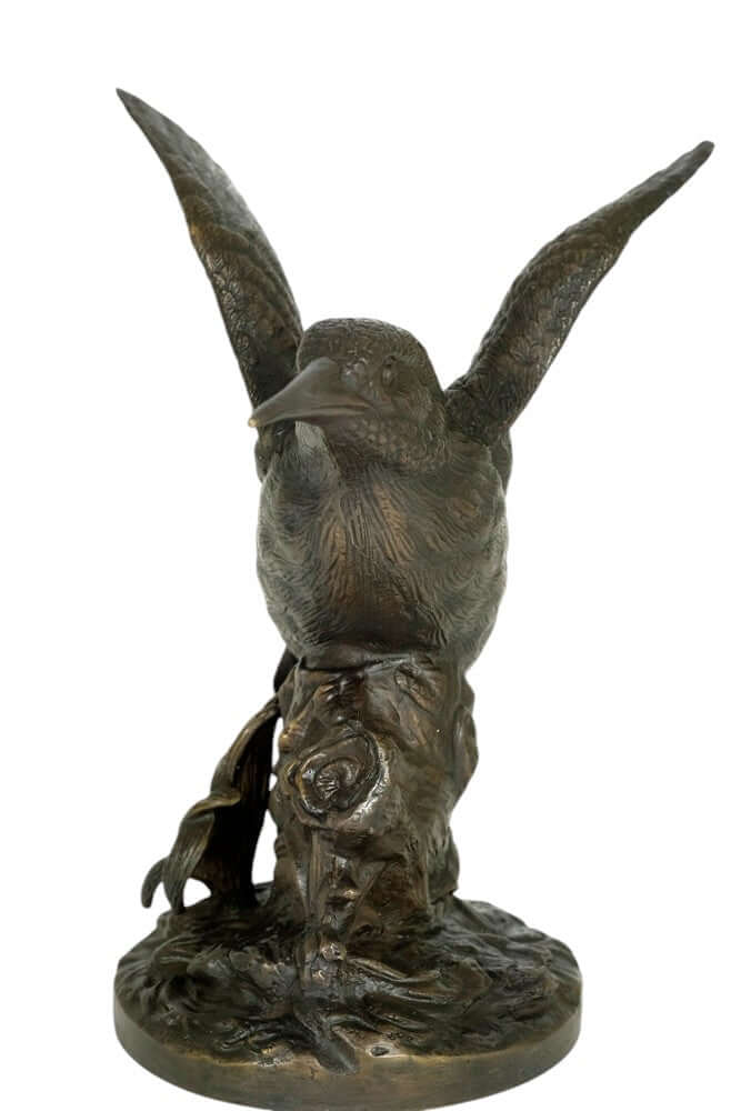 Detailed bronze sculpture of a king fisher with spread wings perched on a tree trunk, 18 x 19 cm.