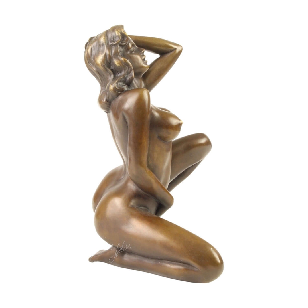 Bronze sculpture of a nude woman in a seductive pose, showcasing sensuality and intricate details.