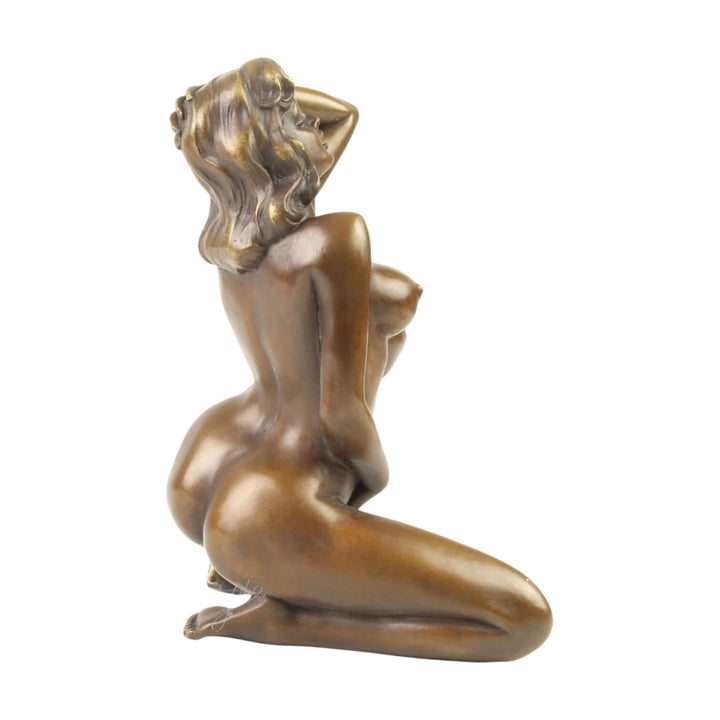 Erotic bronze sculpture of a nude woman, captured in a sensual pose, finished with a warm brown patina.