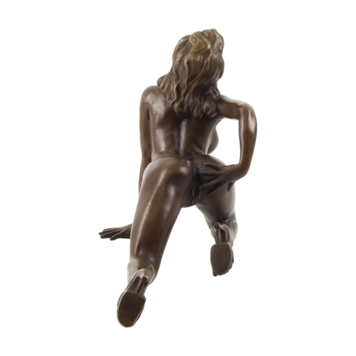 Bronze sculpture of a nude woman on her knees, intricately detailed and erotic, wearing pumps.