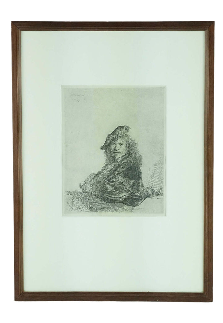 Framed selfportrait etching 'Leaning on a stone sill' by Rembrandt van Rijn, dimensions 32x44 cm, wood frame.