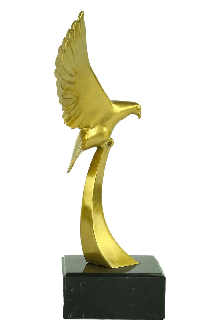 Elegant golden bird sculpture with wings spread, mounted on a black base, perfect for art lovers and collectors.