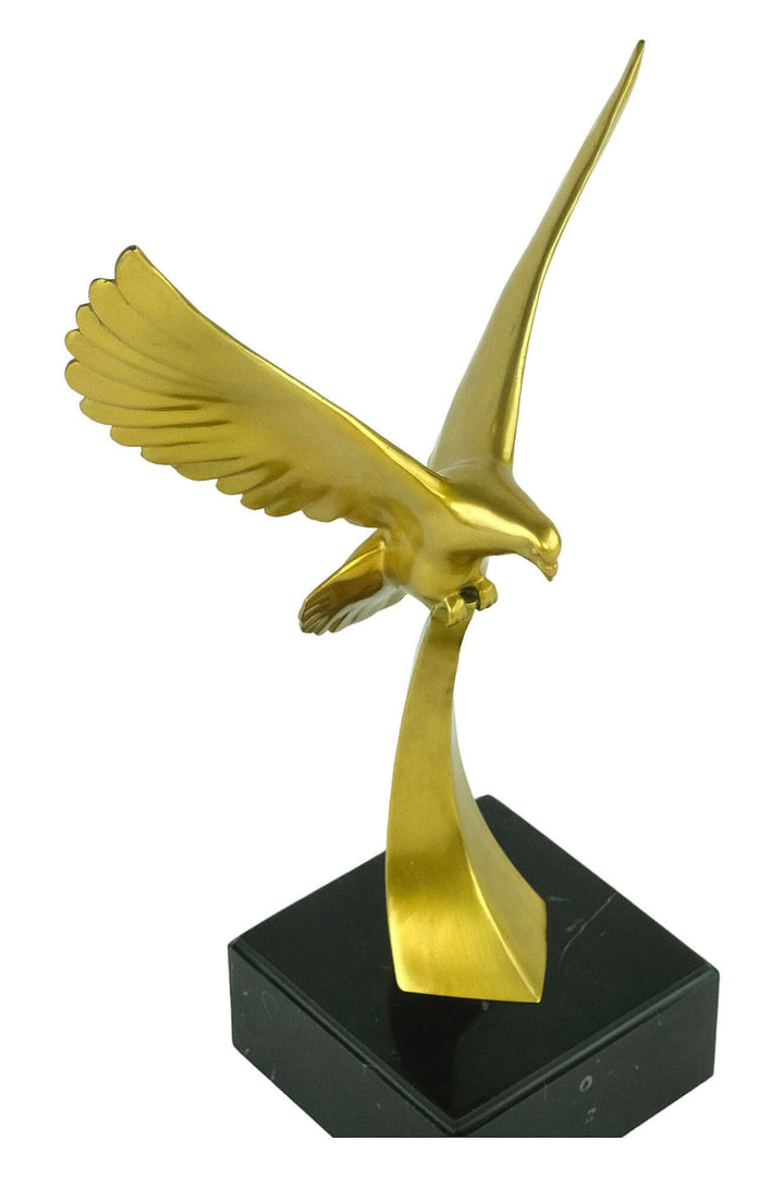 Golden bird sculpture in flight, sleek design mounted on a black base, perfect for bird lovers and home decor.