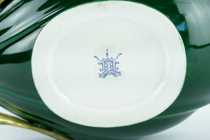 Porcelain bowl base featuring a blue manufacturer mark with crown design, showcasing exquisite craftsmanship.