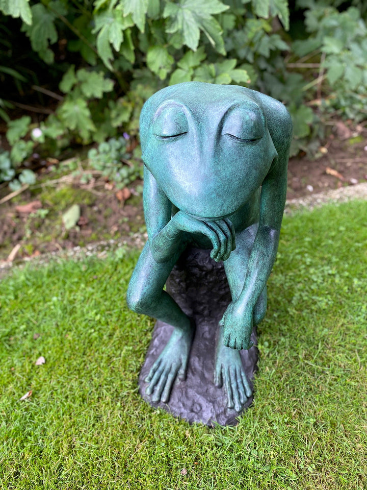 Large bronze sculpture of a thinking frog with serene expression, ideal for home or garden decor.