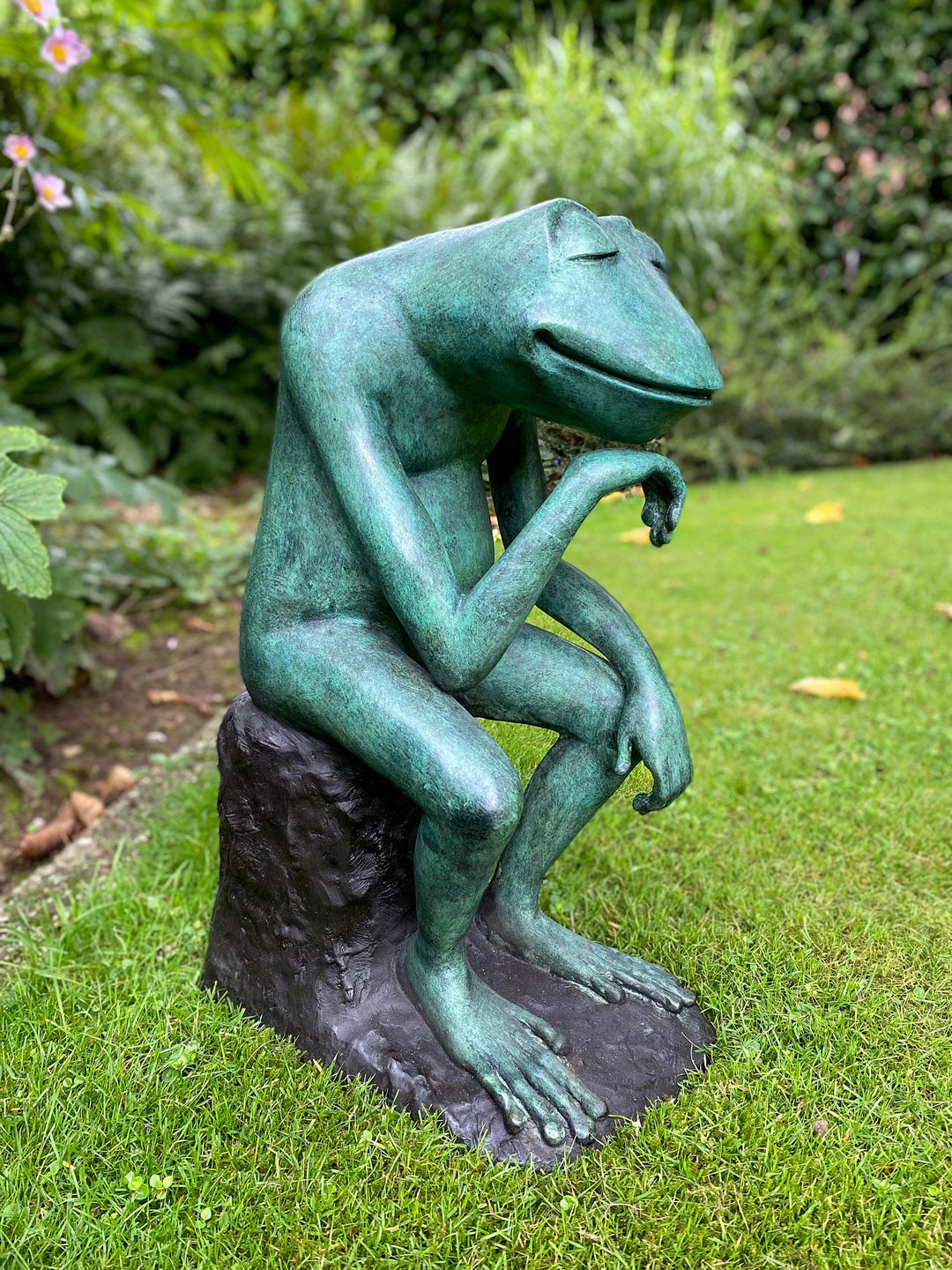 Large bronze sculpture of a thoughtful frog, showing serene expression, perfect for home or garden decor.