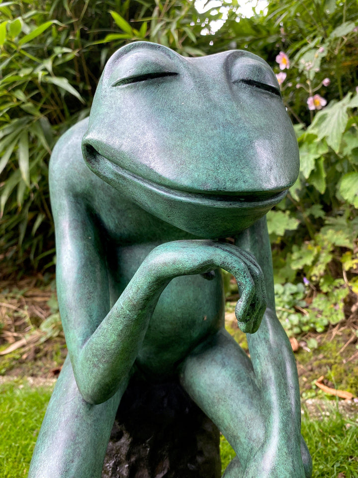 Large bronze sculpture of a thinking frog with serene expression, perfect for home or garden decoration.
