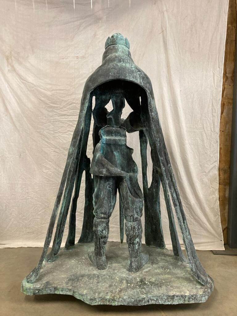 Lifesize bronze sculpture of King Arthur from behind, showcasing intricate design and detail, outdoor garden art.