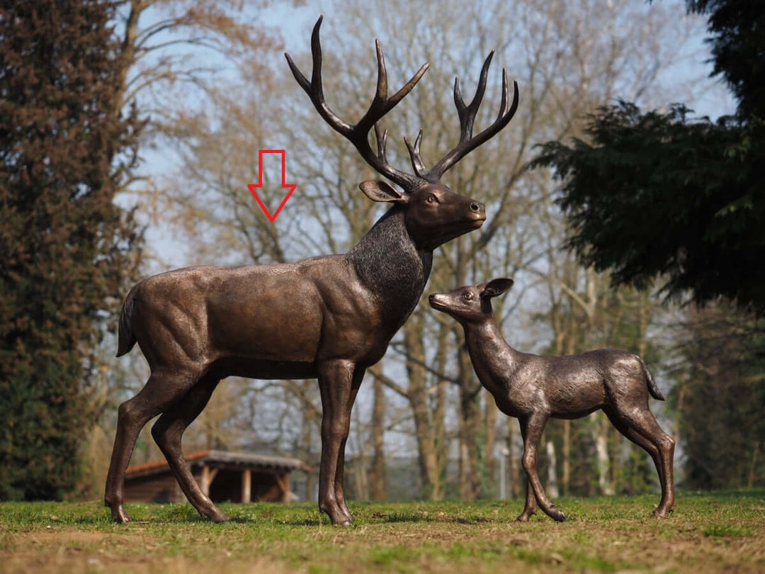 Lifesize bronze sculpture of a standing stag and a fawn, showcasing intricate details and elegant design.
