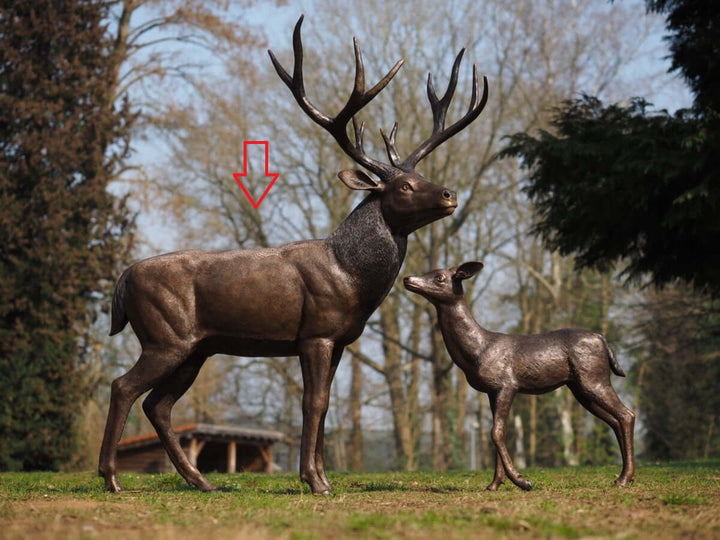 Lifesize bronze sculpture of a standing stag and a fawn, showcasing intricate details and elegant design.