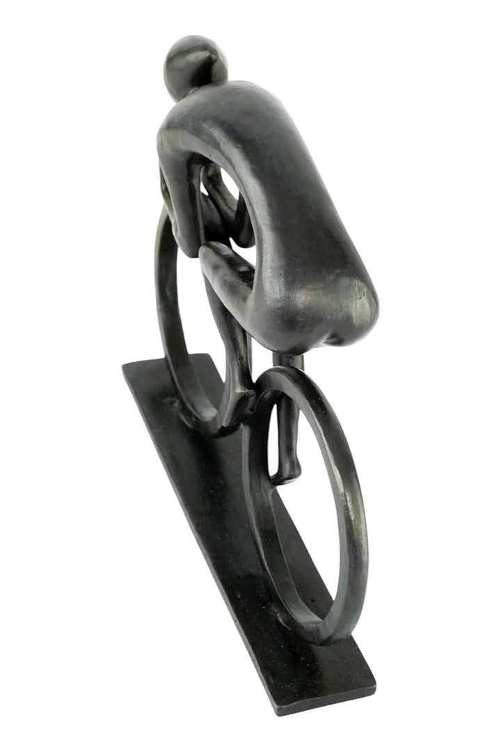 Modern bronze sculpture of a cyclist, showcasing speed and motion with sleek lines and a dark patina finish.