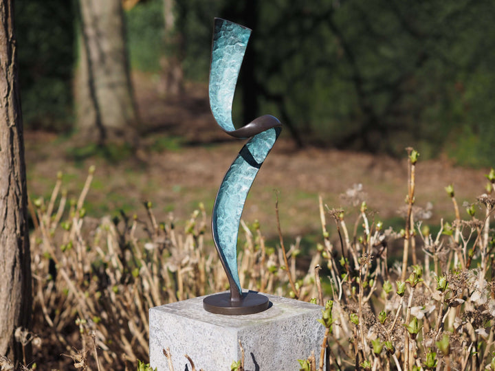 Modern bronze helix spiral sculpture with patina, perfect for outdoor display in contemporary settings.