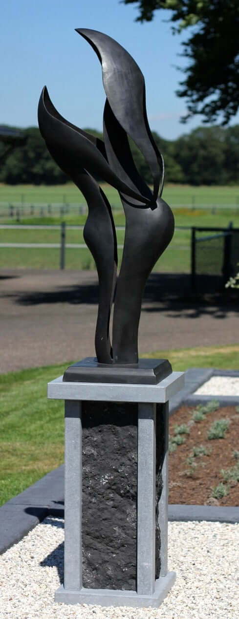 Elegant bronze sculpture on a pedestal, symbolizing unity and harmony, suitable for outdoor display.
