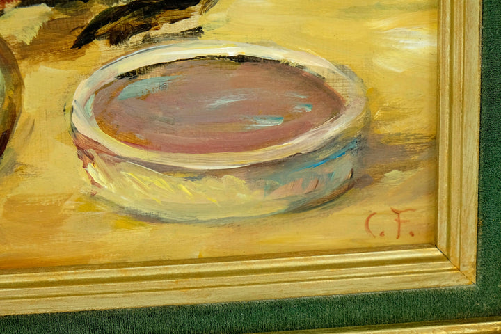 Detail of an oil painting by Claude Firmin, featuring a round dish in soft colors, signed 'C.F.' in the corner.