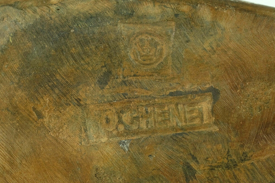 Signature and foundry stamp of bronze female sculpture by Pierre Chenet, showcasing authenticity and craftsmanship.
